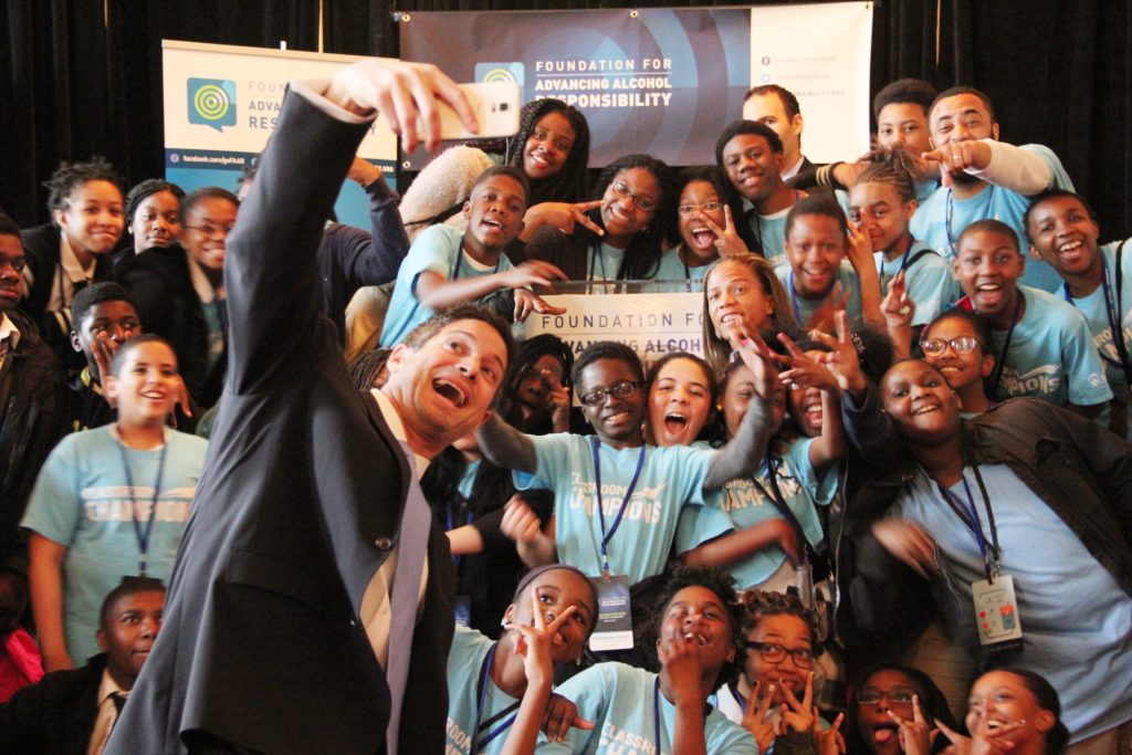Classroom Champions CEO Steve Mesler takes a selfie with Jerome Clemons and his students at Responsibility.org's annual Take Our Daughters and Sons to Work Day on Capitol Hill on April 23, 2015.